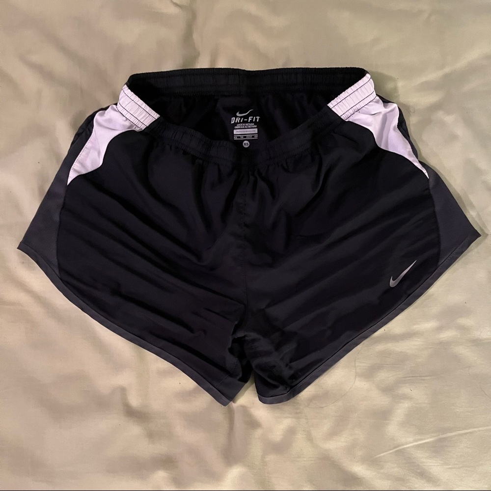 Nike Dri-Fit shorts, say XS but they do have an elastic band and can fit most.